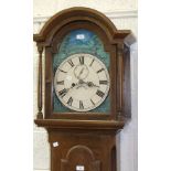 A Victorian stained pine long case clock with repainted arch dial, the twin-trained movement