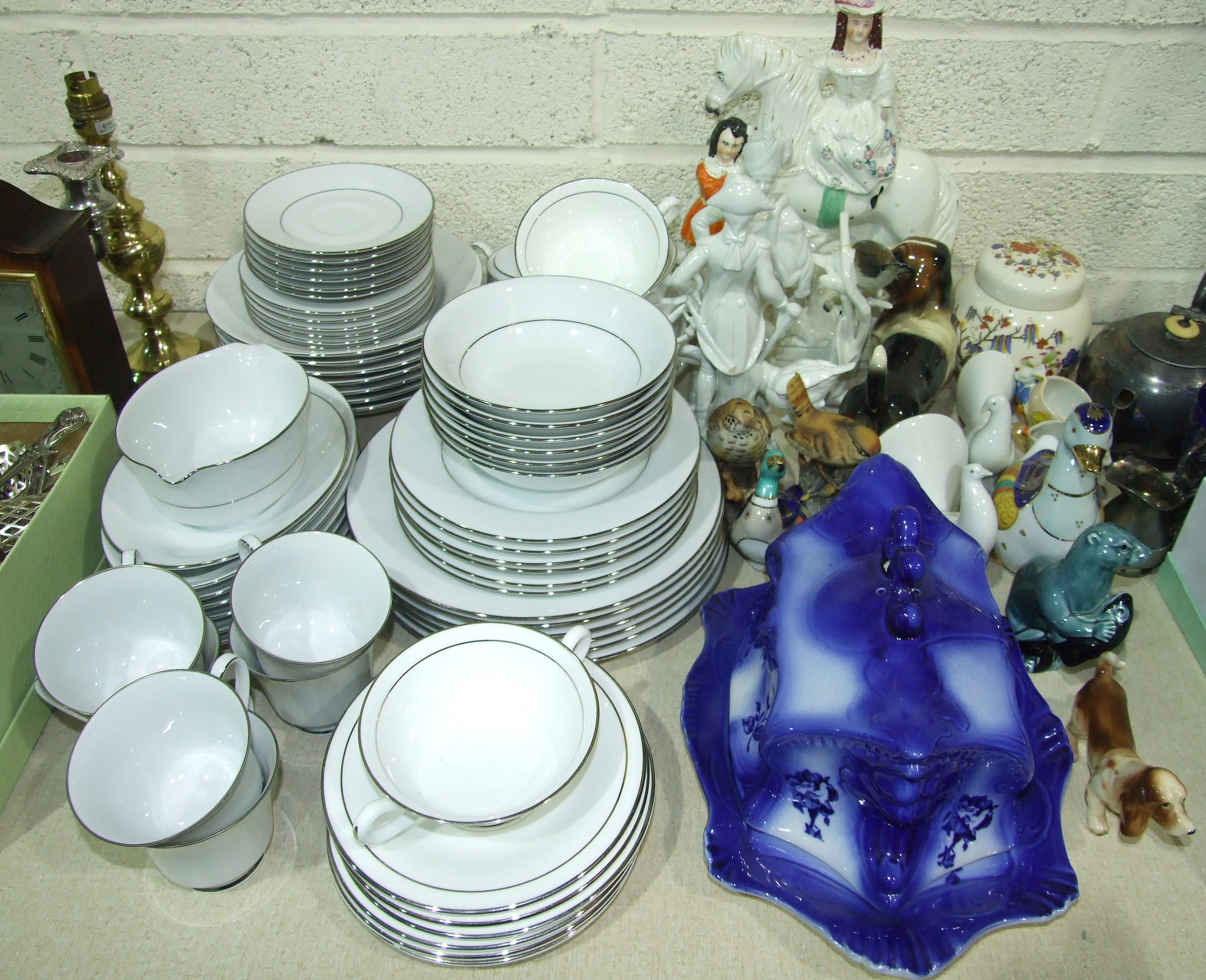 Approximately sixty pieces of Noritake 'Regency Silver' tea and dinner ware, various animal and