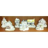 A collection of seven Coalport bone china cottage models, including: 'The Country Cottage', 'Keepers