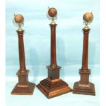 A set of three Masonic pedestal columns, each with metal and wood terrestrial globe finial, 1 x