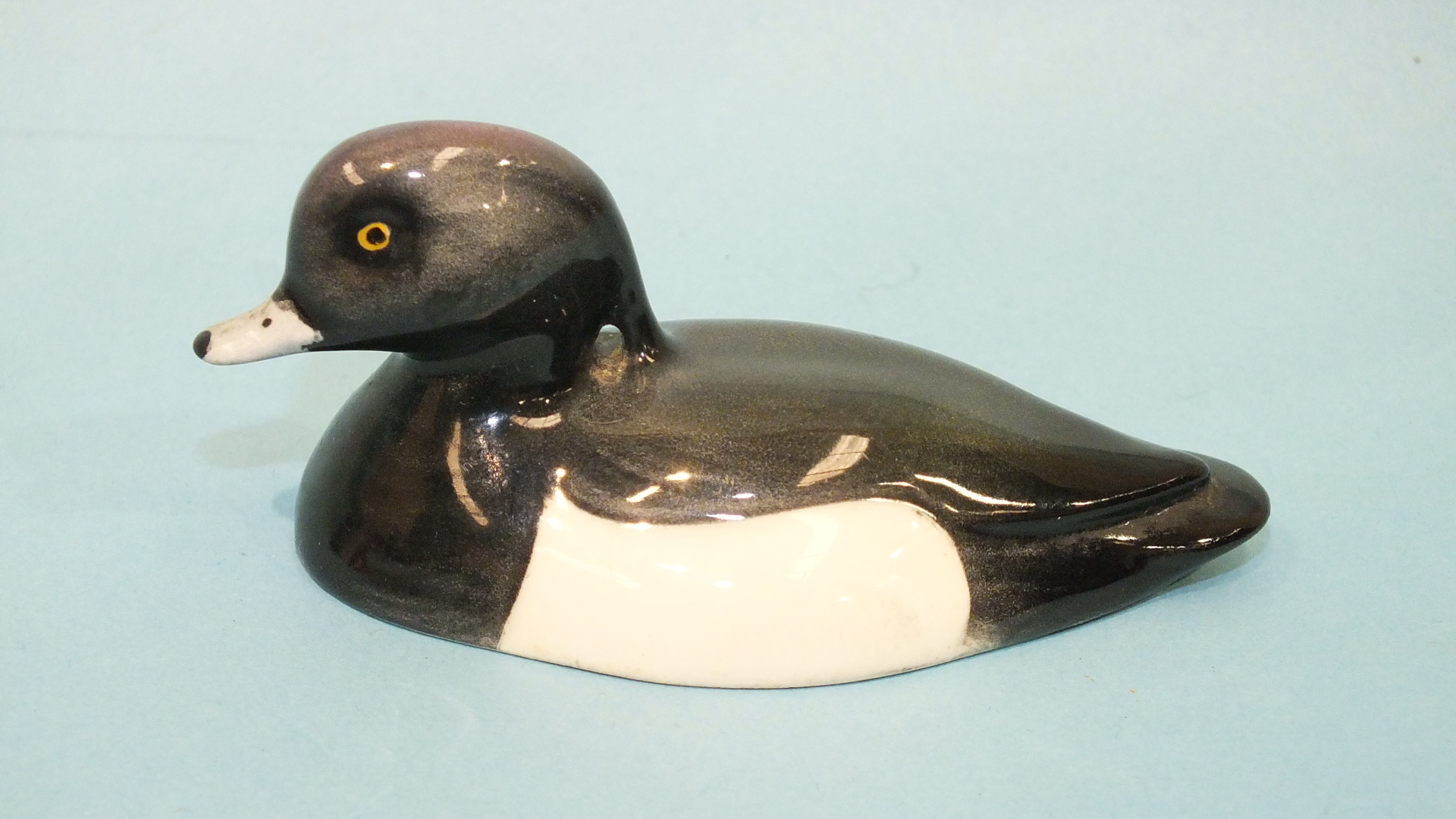 A Beswick 'Tufted Duck', printed mark and 'Approved by Peter Scott' beneath, 8cm.