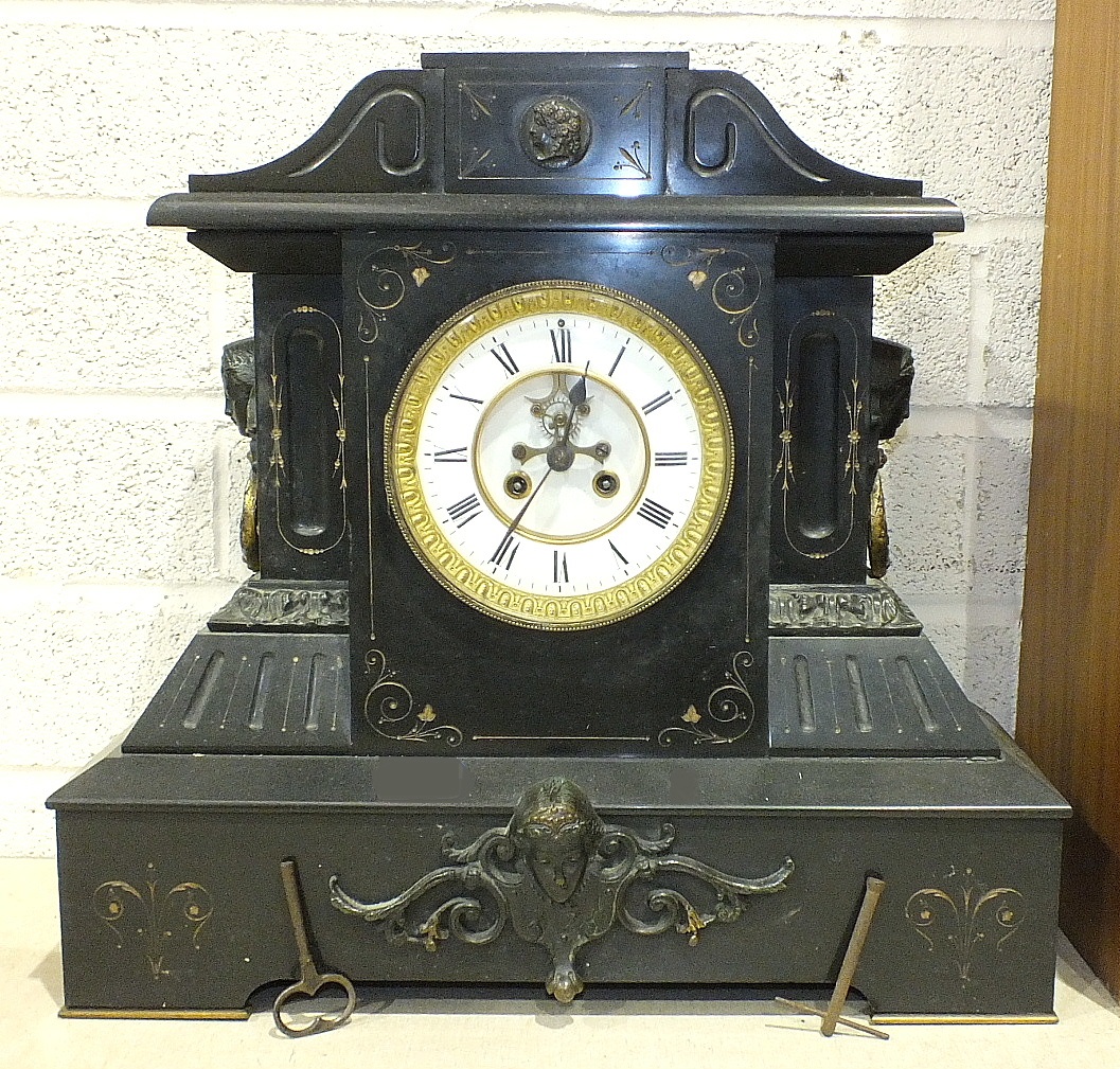 A large black marble mantel clock of architectural form, the case with gilt detail and gilt metal