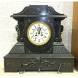 A large black marble mantel clock of architectural form, the case with gilt detail and gilt metal