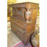 A reproduction oak court cupboard, 121cm wide, 140cm high, 42cm deep.