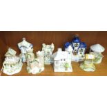 A collection of four Coalport bone china cottage models, including: 'Castle Lodge', 'The Toll