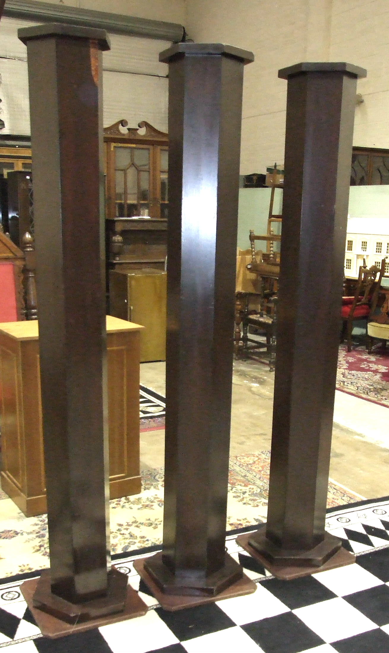 Three Masonic stained wood pillars, various pine benches and kneeling stools.