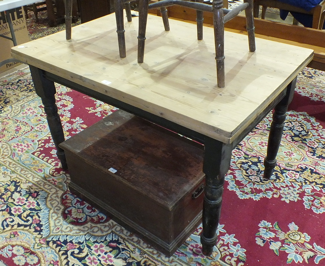 A pine chest, 71cm wide, a scrub-top pine kitchen table with end drawer, on turned legs, 80 x