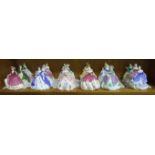 A collection of eighteen Coalport bone china 'Fairest Flowers' figures, all with certificates,