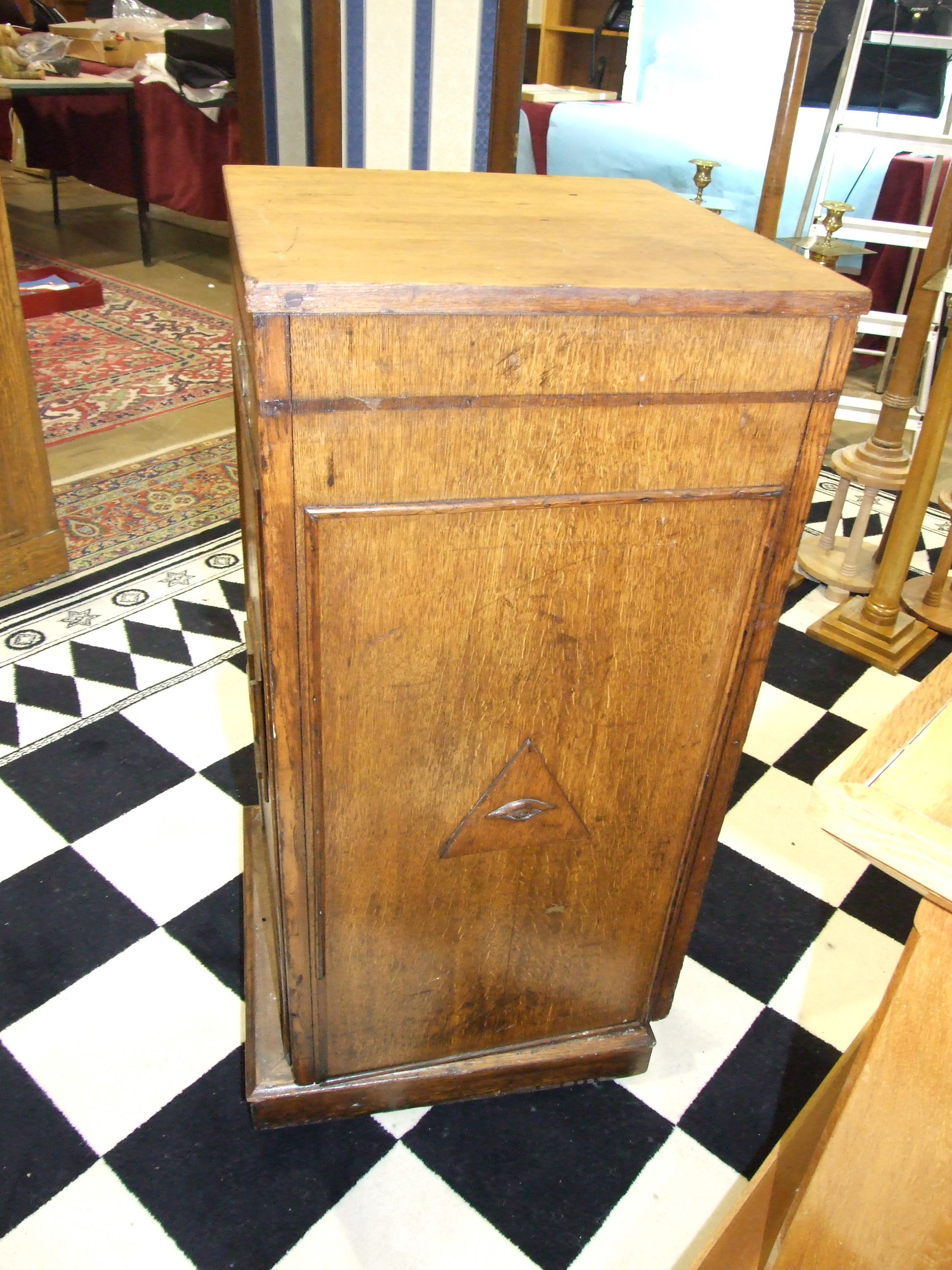 A Masonic oak pedestal with applied wood symbols, on castors, a square-form oak pedestal on - Image 4 of 4