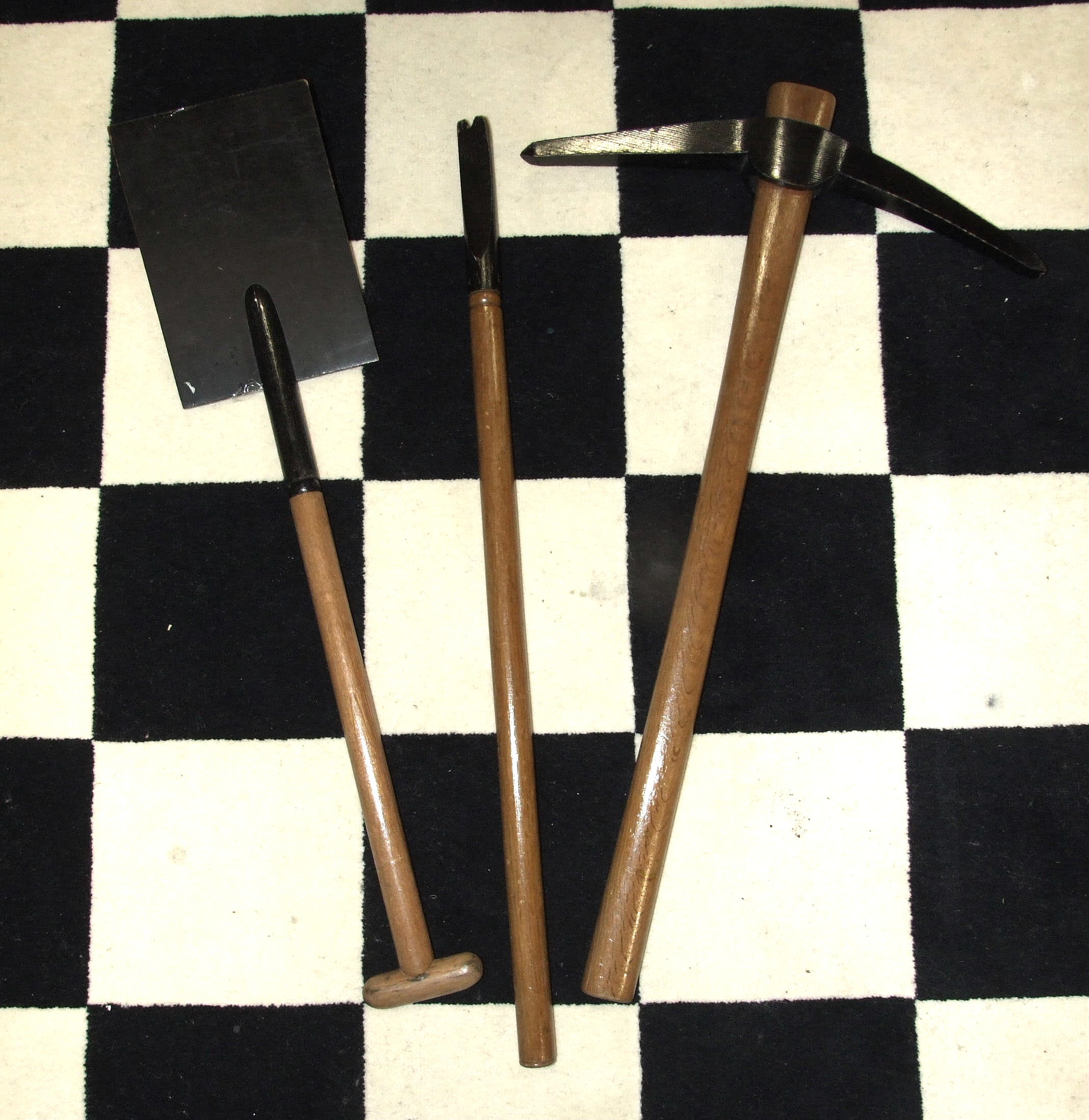 A set of Masonic HRA implements of labour, of painted and turned wood.