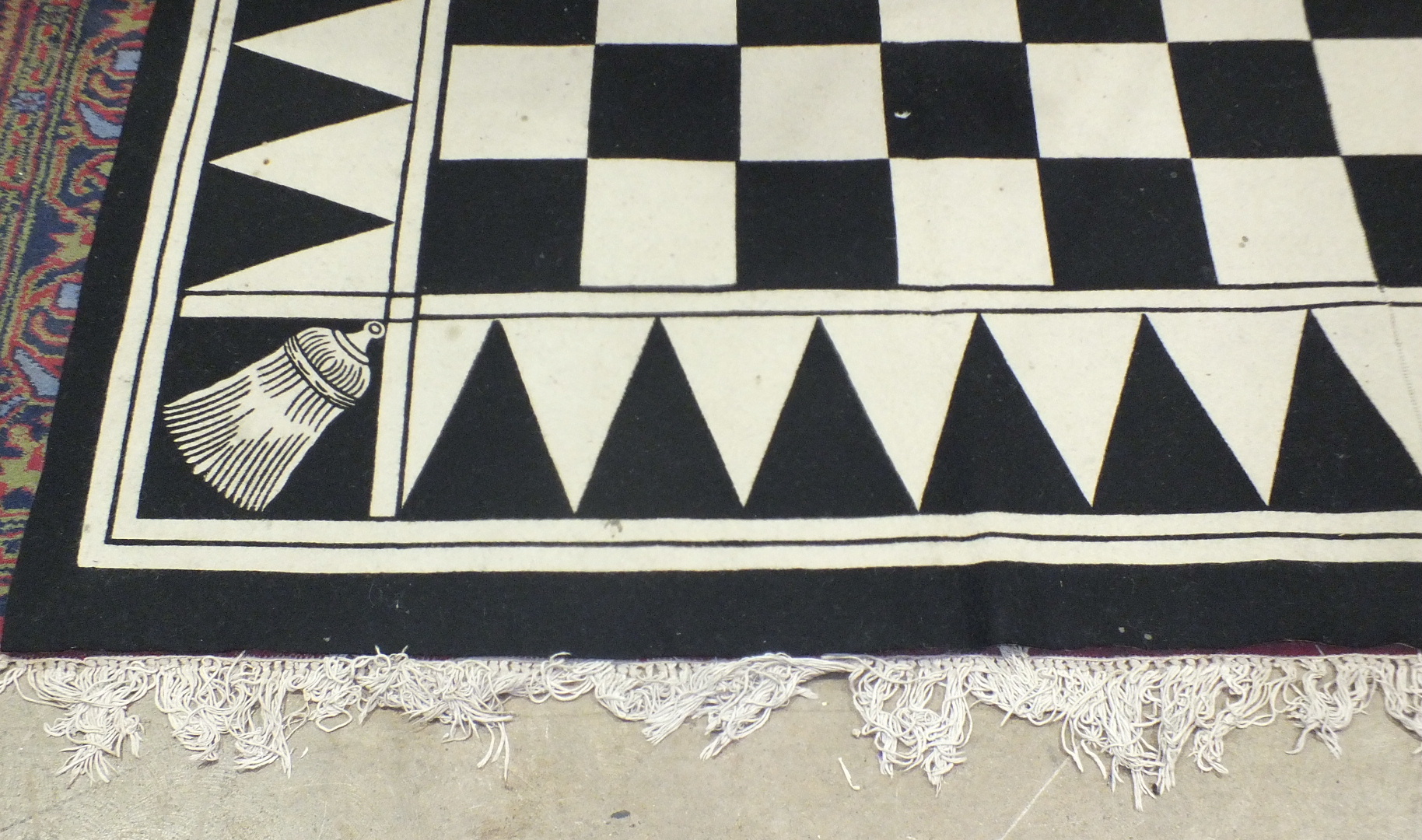 An HRA black and white chequered carpet, 256 x 365cm.