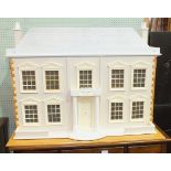 A modern doll's house with double-hinged front, 97cm wide, 73cm high, together with a quantity of