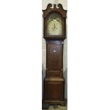 An early-19th century oak and mahogany-banded long case clock, the arched 32cm painted dial with