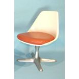 A moulded fibreglass Arkana swivel chair with orange pad seat, on alloy four-branch support.