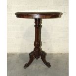 A 19th century rosewood tilt-top table, the circular top inset with painted and gilt design, (