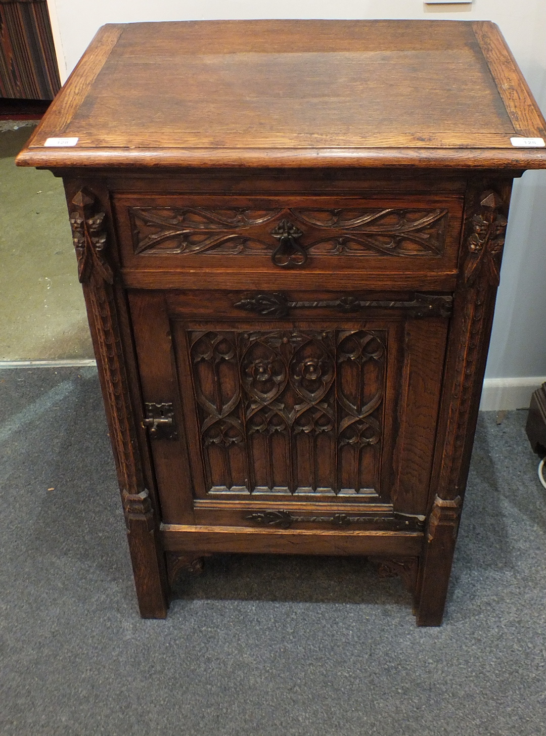 A 20th century French oak Gothic pedestal cupboard of rectangular form, with Gothic carved drawer - Image 2 of 2