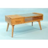 A G-Plan oak low telephone table with partially-glazed top and double-sided drawer, on splayed