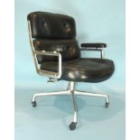 A Herman Miller Time Life chair designed by Charles & Ray Eames, with leather button pads and