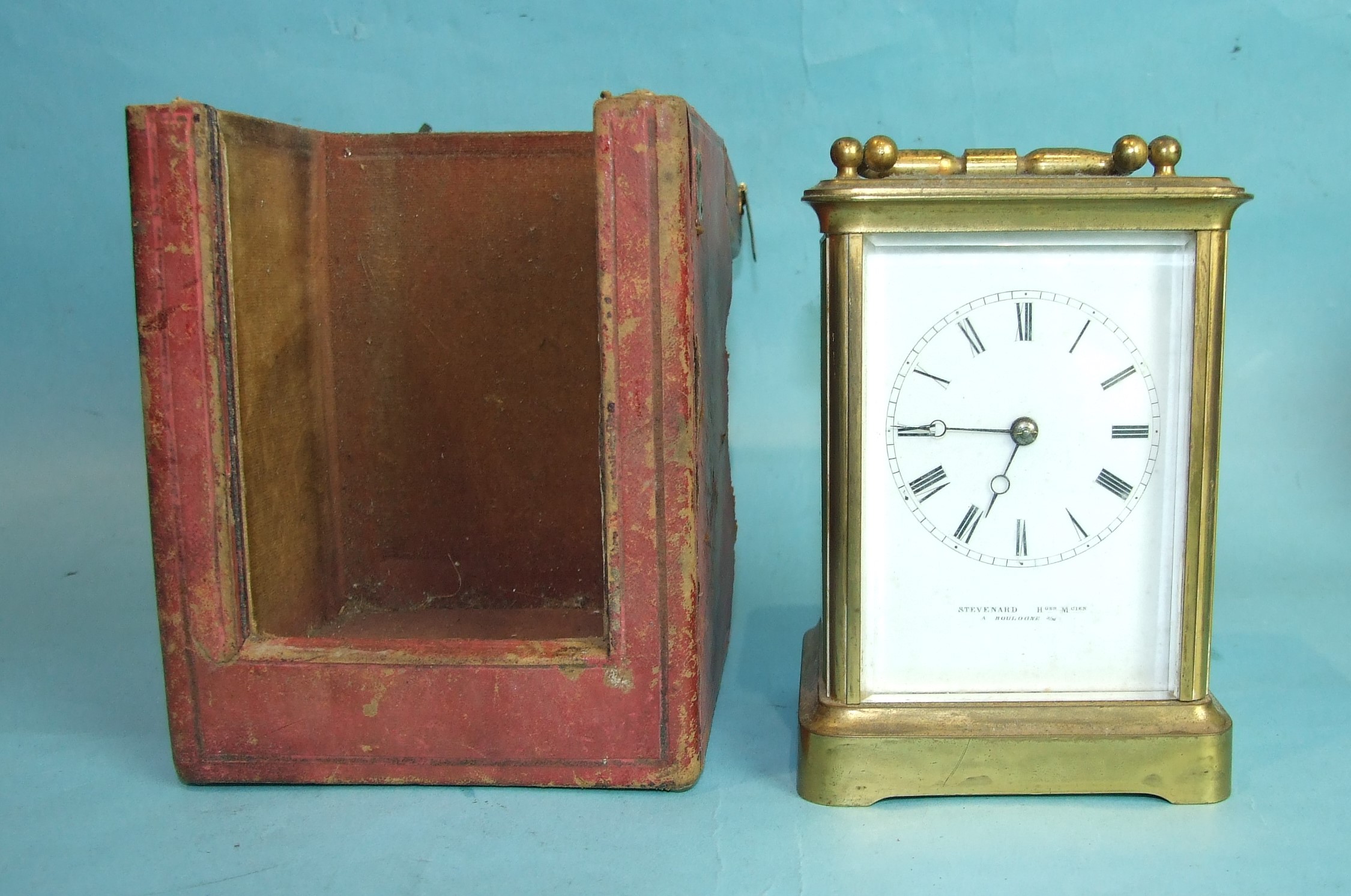 A 19th century French brass carriage clock with bell-striking movement, the white enamel dial signed