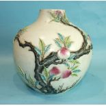 A 19th/20th century Oriental baluster-shaped vase decorated in relief with pomegranate trees and a