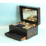 A Victorian ladies coromandel wood dressing case with plate-mounted bottles and concealed