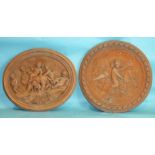 A modern cast terracotta oval plaque moulded with a classical scene of a lion and cherubs, 58 x 48cm