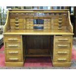 A good quality mahogany roll-top desk, the tambour front enclosing a comprehensive range of filing