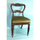 A set of four 19th century mahogany balloon-back dining chairs, each with carved and pierced top