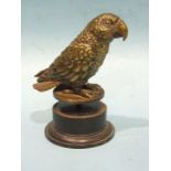 An early-20th century bronze parrot mascot, on circular base, 11cm high excluding screw thread, (