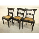 Three 19th century Colonial ebony chairs of pegged construction, each with carved top and centre
