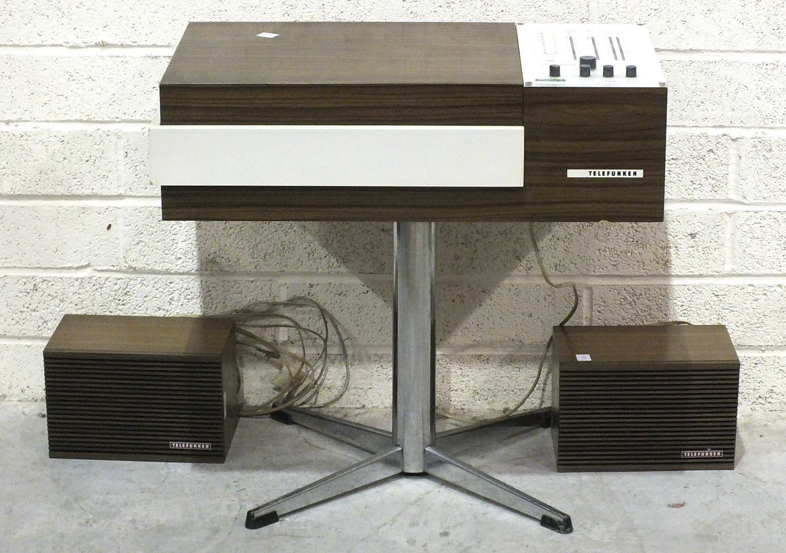 A Telefunken Rondo Stereo 101, in wood-finished case, on chrome stand, with a pair of speakers.