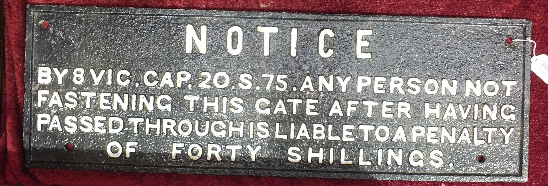 A cast iron railway sign "NOTICE BY 8 VIC.CAP.20.S.75 ANY PERSON NOT FASTENING THIS GATE AFTER