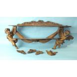 A 19th century Continental soft wood wall shelf bracket, the two shaped shelves supported at each