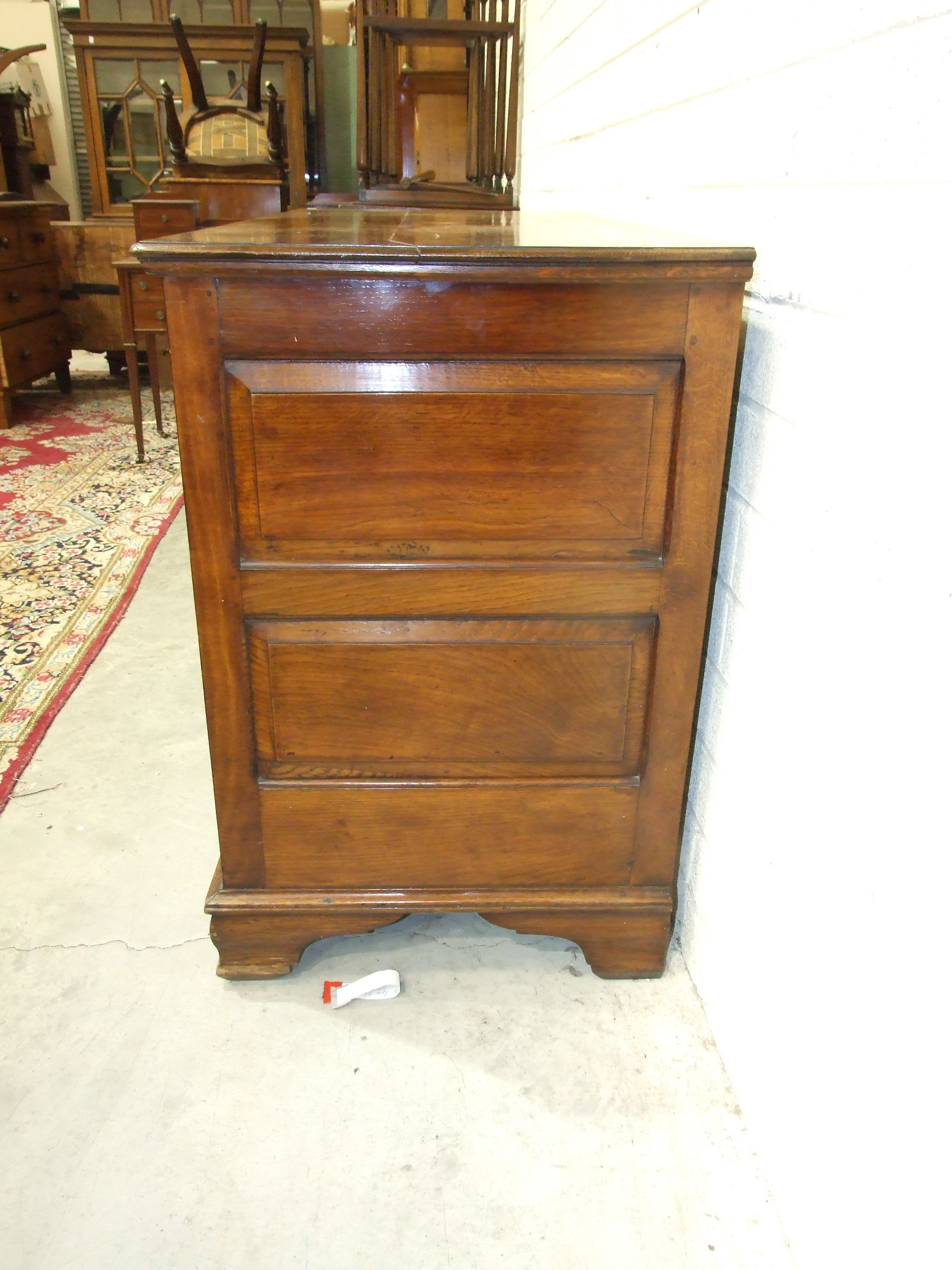 A large oak hall chest constructed of fielded panels, raised on shaped bracket feet, 143cm wide, - Image 2 of 2