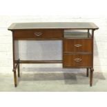 A 1970's mahogany-finished writing desk, the curved top with writing surface above three drawers, on