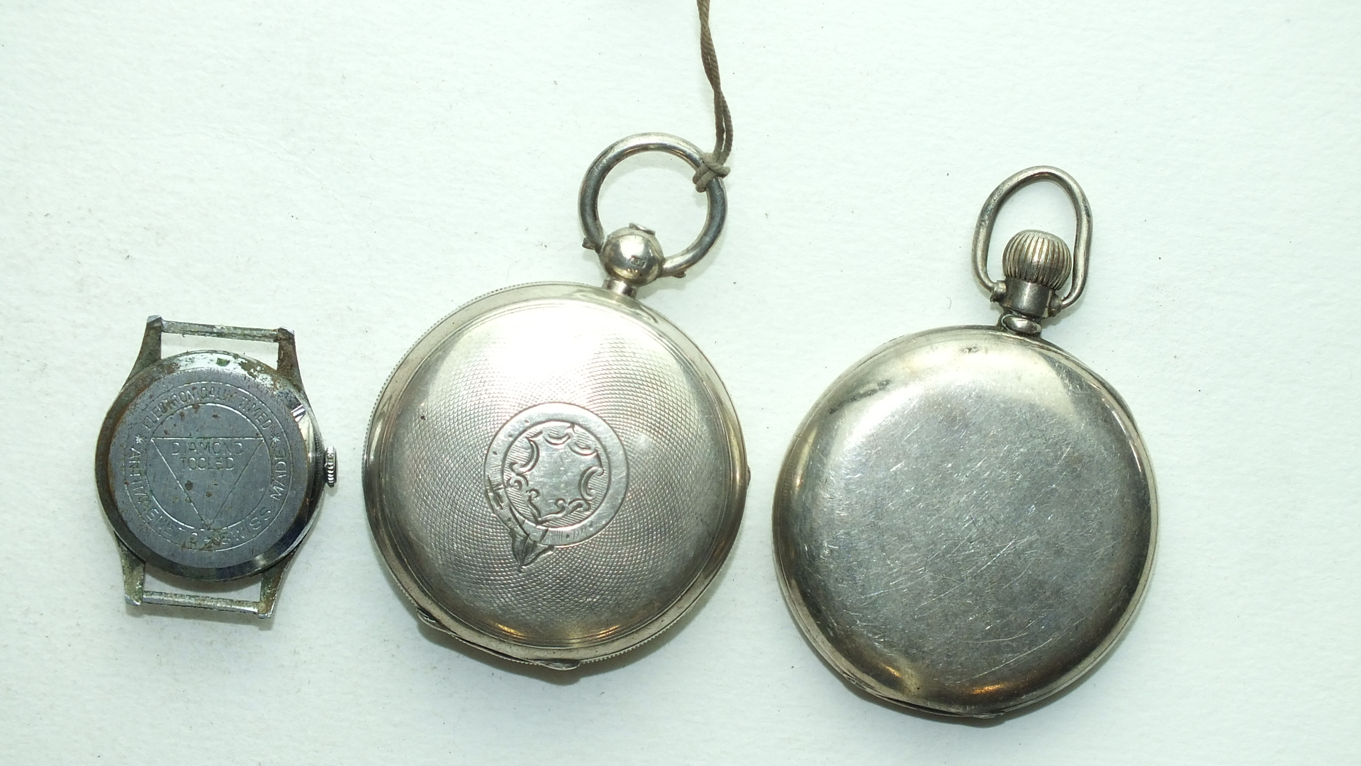 Two silver-cased open-face pocket watches, (1 a/f) and a Lomedo wrist watch, (a/f), (3). - Image 2 of 2