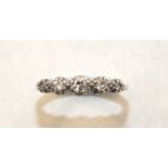 A five-stone diamond ring claw-set graduated brilliant and 8/8-cut diamonds in 18ct yellow gold