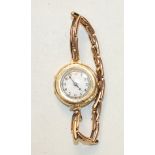 A ladies 15ct-gold-cased wrist watch on 9ct gold sprung bracelet, gross weight 20.5g.