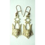 A pair of Victorian ivory pendant earrings carved in the form of cherubs' heads and wings, later