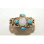 A 19th century ring set opal and turquoise cluster between scrolling shoulders, with engraved shank,