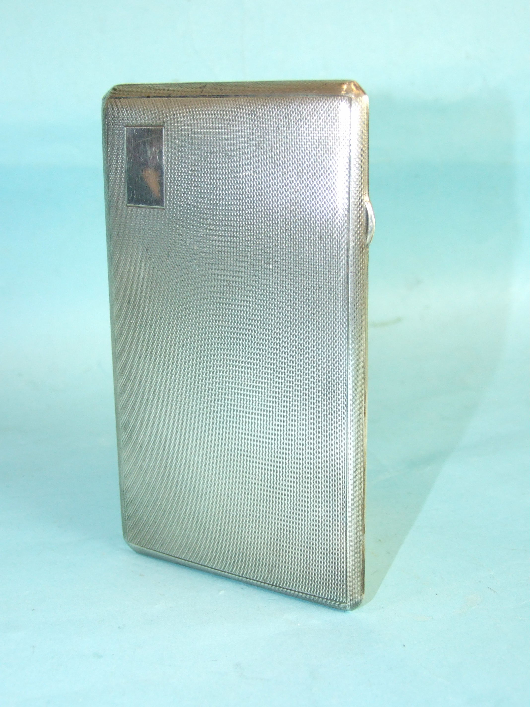 A rectangular engine-turned cigarette case, 14.5 x 8.5cm, Birmingham 1945, ___7oz.