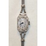 A ladies Art Deco cocktail watch, the octagonal platinum case with 8/8-cut diamond-set bezel, on 9ct