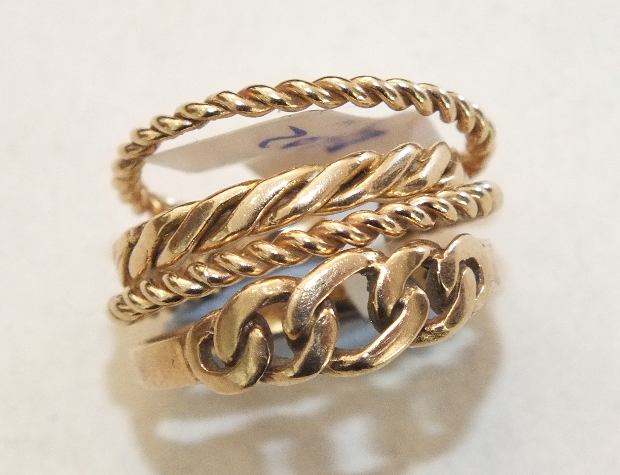 Three 9ct gold rings of rope-twist form, sizes G, K and M and another 9ct gold ring, size M, 5.