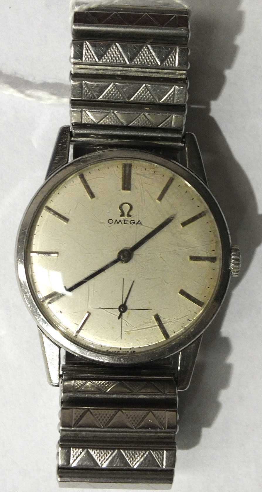 Omega, a gent's wrist watch c1962, the silvered dial with baton numerals and seconds subsidiary, the