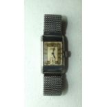 Tissot, a gentleman's 1930's rectangular wrist watch, the two-tone dial marked "Tissot Non-