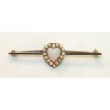 A gold bar brooch centrally-set an opal and pearl heart-shaped cluster, in 15ct gold mount, 5.1cm