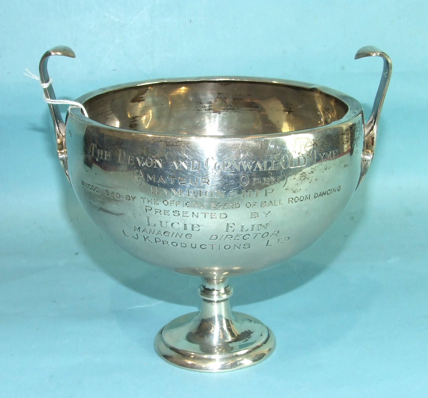 A plain silver two-handled trophy cup on circular foot, 19cm high, 20cm diameter, Birmingham 1912,