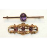 A 9ct gold bar brooch collet-set an oval amethyst, 3.9g and a yellow metal brooch set three garnets,