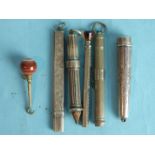 A silver pencil of ribbed form, Birmingham 1896, other pencils, an agate-topped button hook and a