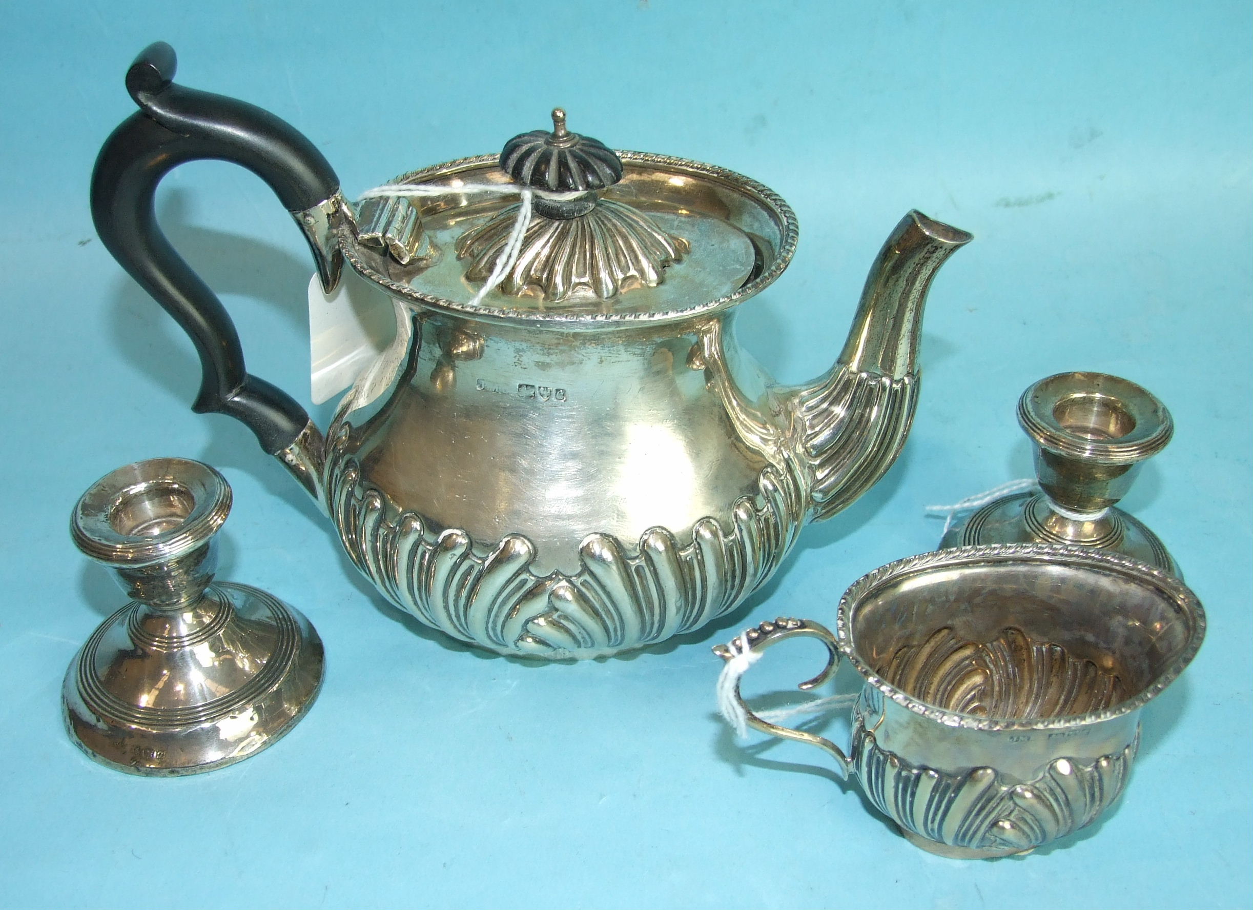 An Edwardian bachelor's half-gadrooned teapot and cream jug, Chester 1903, (inscription removed) and